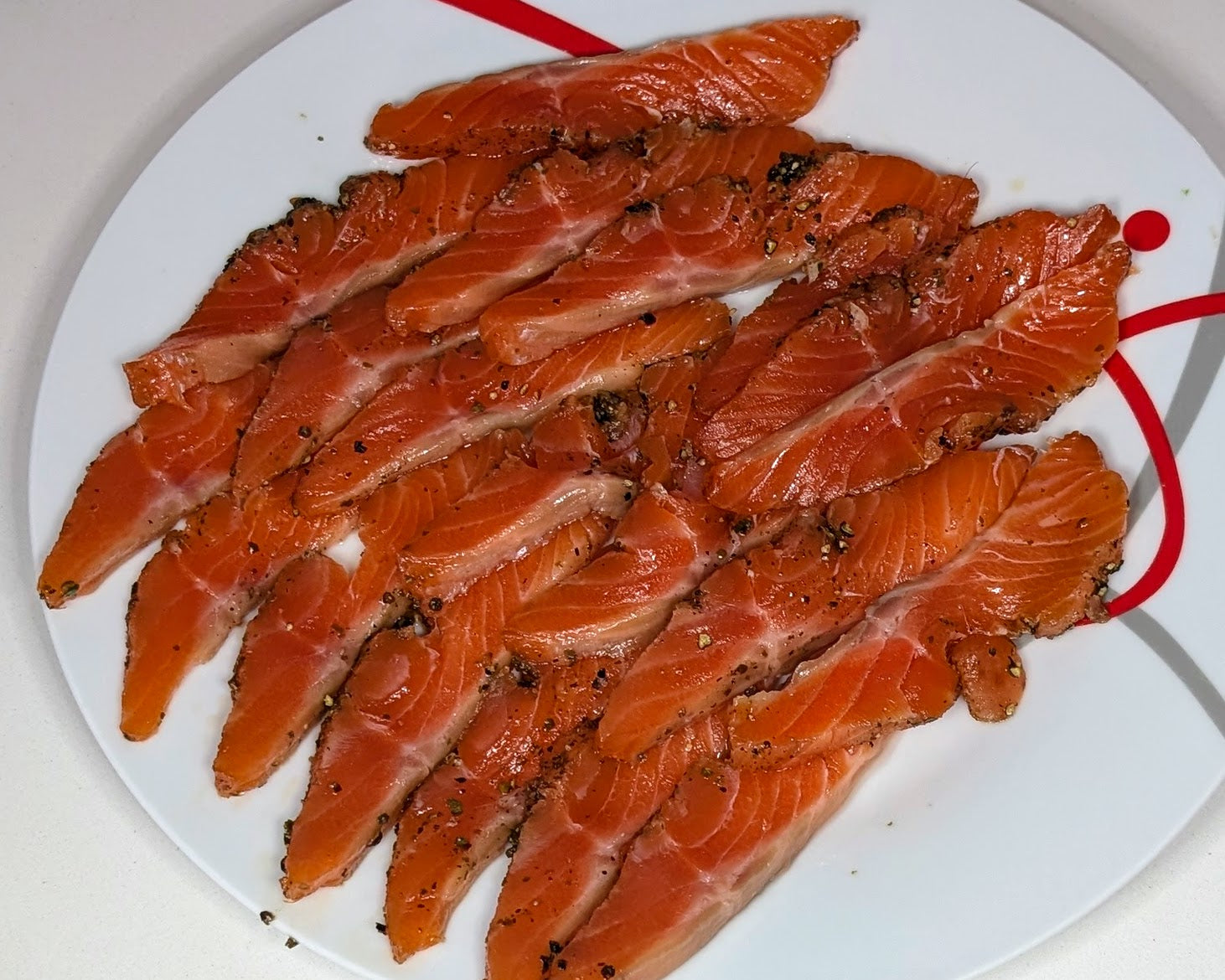Saumon gravlax maison au trio de poivre Rinoci