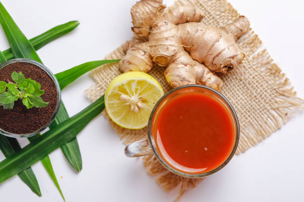 Natural immune-boosting spices including turmeric, ginger, and garlic on a rustic health tray